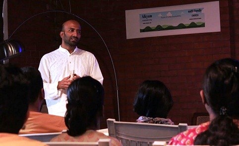Sandeep Anirudhan addresses the audience at an Aikyam event